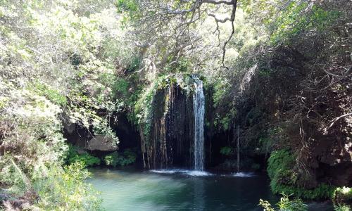 a waterfall in the middle of a pool of water at Sabie Self Catering Apartments in Sabie