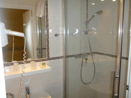 a bathroom with a shower and a sink at Hotel Cayrons Vence & St Paul de Vence in Vence