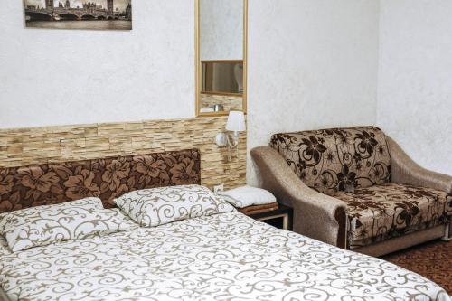 Ένα ή περισσότερα κρεβάτια σε δωμάτιο στο Hotel Rafinad