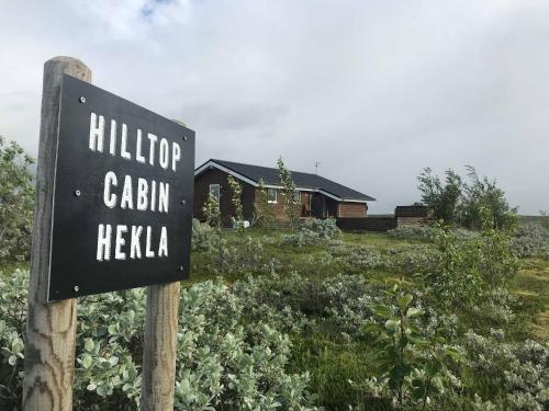 a sign in front of a house at Hilltop Cabin Hekla - Golden Circle - Geysir - Mountain View in Reykholt