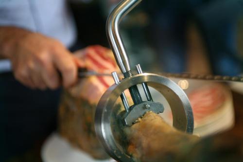 a close up of a persons hand in a blender at Hotel Noce in Brescia