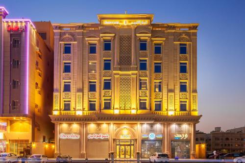 a large building with lights in front of it at Western Lamar Hotel in Jeddah
