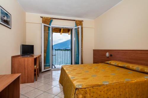 Кровать или кровати в номере Hotel Regina