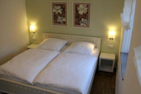 Ένα ή περισσότερα κρεβάτια σε δωμάτιο στο Ferienwohnung am Pfaffe-Kai