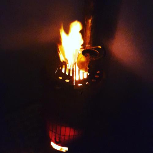 a pot with fire in it at night at Farm Stay Mharchen in Chefchaouene