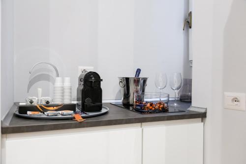 a kitchen counter with a plate of food on it at Opera Private Suites by Premium Suites Collection in Rome