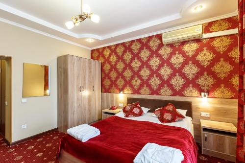 Кровать или кровати в номере Renion Zyliha Hotel