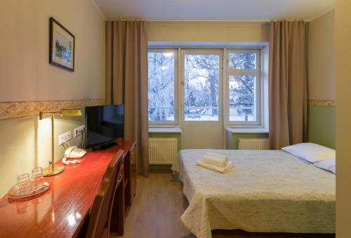 Ein Bett oder Betten in einem Zimmer der Unterkunft Wasa Hotel & Health Center
