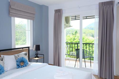 Ένα ή περισσότερα κρεβάτια σε δωμάτιο στο Living at Sphere Family room