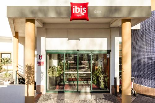a store front with a ups sign on it at Hotel ibis Evora in Évora