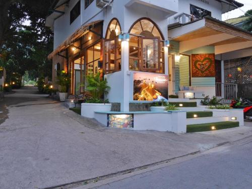 a building with a fire in the front of it at DD Hut Koh Tao in Koh Tao