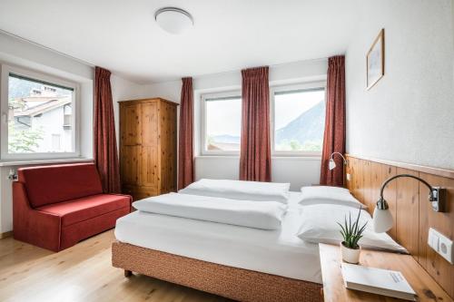 Ένα ή περισσότερα κρεβάτια σε δωμάτιο στο Apartments Mühlegg