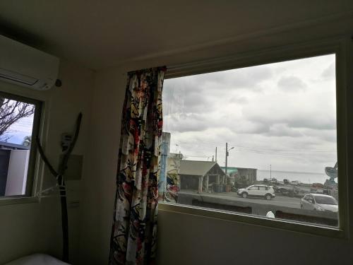 a window in a room with a view of a street at 自然海naturalhigh in Dahan