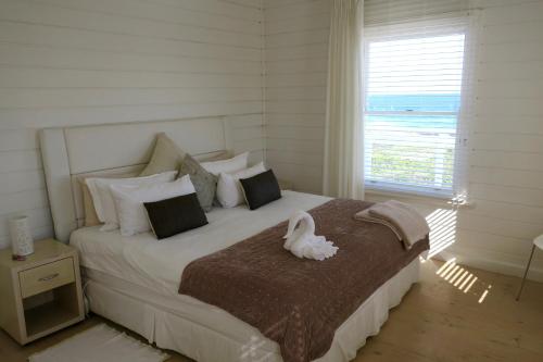 Postel nebo postele na pokoji v ubytování Pearl Bay Beach Home