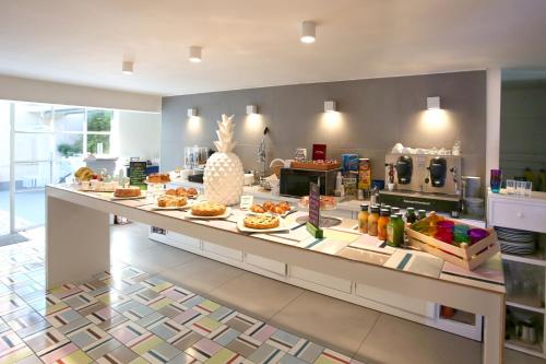 a bakery with a counter with food on it at Albergo Del Pino in Cercola