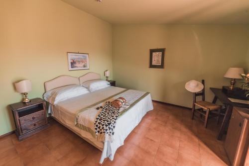 a child laying on a bed in a bedroom at Hotel Villa Sirina in Taormina