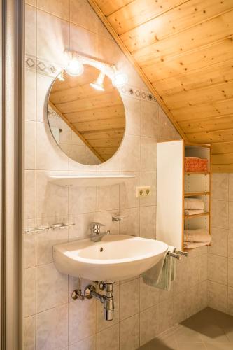 a bathroom with a sink and a mirror at Urbangut in Sankt Michael im Lungau