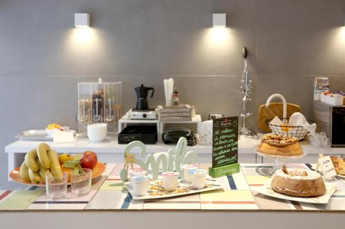 a buffet with food on a table in a kitchen at Albergo Del Pino in Cercola