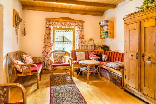 a living room with a couch and chairs and a table at Urbangut in Sankt Michael im Lungau