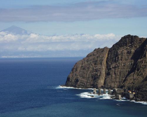 an aerial view of the ocean and a mountain at LOS FRAILES I in San Sebastián de la Gomera