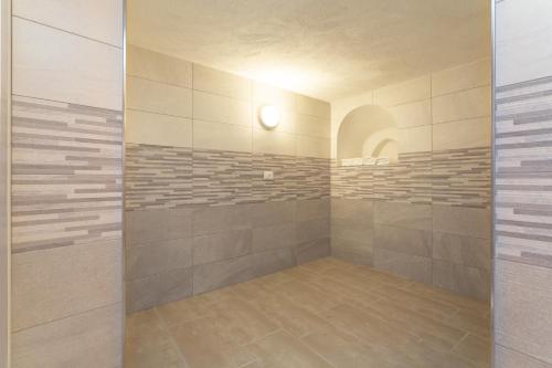 a bathroom with a shower with a glass door at Casa Leonardo in Casamicciola Terme