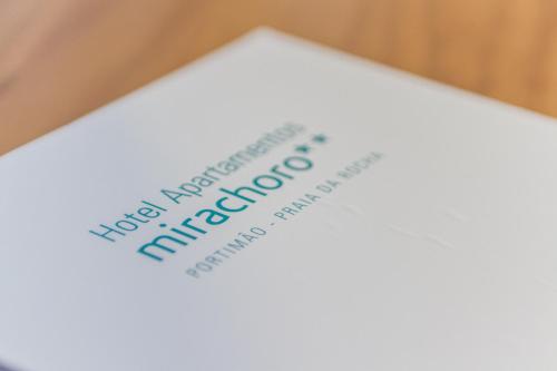 a piece of paper with the words new immigrant immigration on it at Mirachoro Praia da Rocha in Portimão