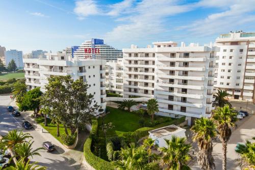 an aerial view of buildings in a city at Mirachoro Praia da Rocha in Portimão
