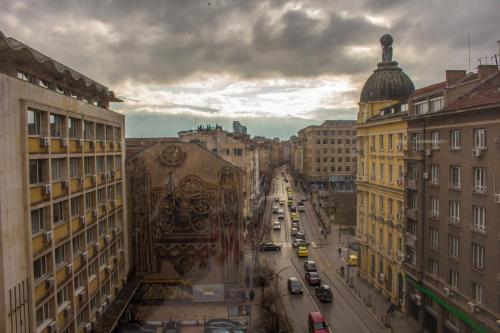 a view of a city street with cars and buildings at Slavyanska Beseda Hotel in Sofia