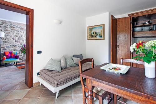 a living room with a couch and a table at Agriturismo La Palazzetta di Assisi in Assisi