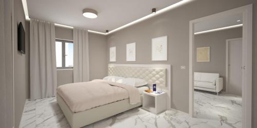 Residence Hotel Alba Palace tesisinde bir odada yatak veya yataklar