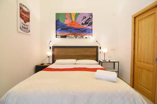 Postel nebo postele na pokoji v ubytování B&B Ninarella Napoli