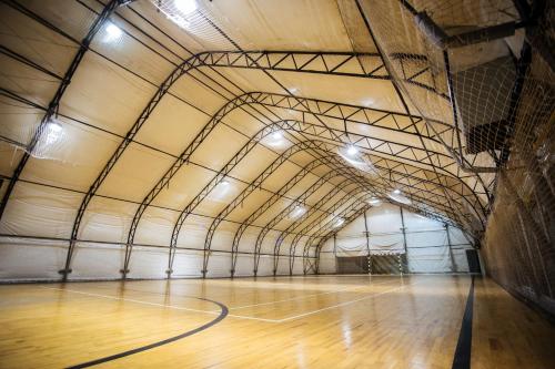 an empty gym with a basketball court in a building at LH Hotel&SPA in Lviv