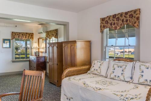 a living room with a couch and a window at First Colony Inn in Nags Head