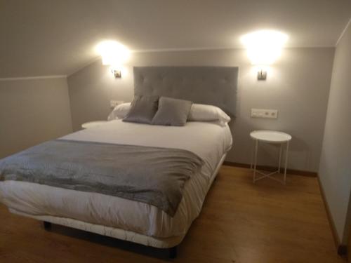 Кровать или кровати в номере Apartamentos Prestin