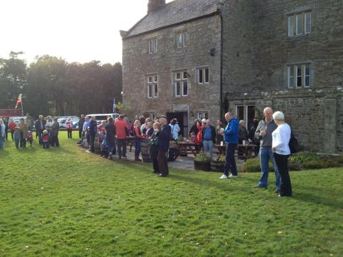 a group of people standing outside of an old building at Clennell Hall Country House - Near Rothbury - Northumberland in Alwinton