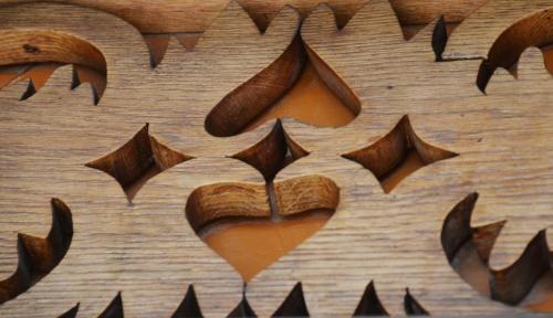a wooden table with a heart carved into it at Hotel Restaurant Bahnhof in Schüpfen