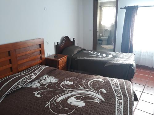 Postel nebo postele na pokoji v ubytování AzoresDream