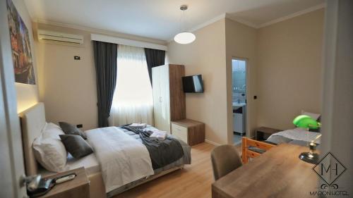 Postel nebo postele na pokoji v ubytování MARION HOTEL