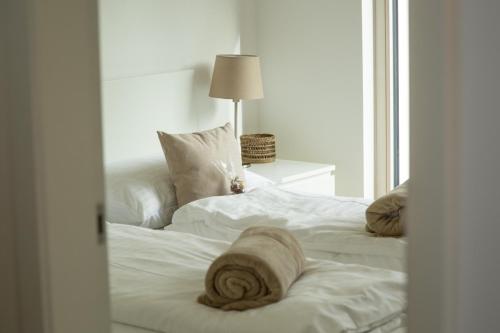 Un pat sau paturi într-o cameră la Salzburg Loft