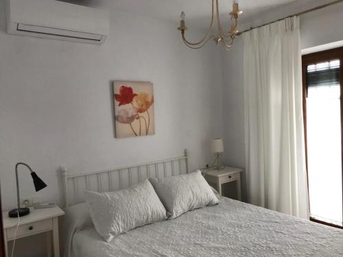 Postel nebo postele na pokoji v ubytování Casa Calle Alta Maria Bajo