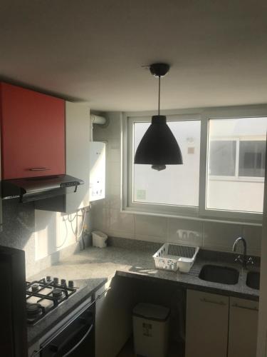 Kuhinja oz. manjša kuhinja v nastanitvi Departamento Edificio Terrazas de Sol