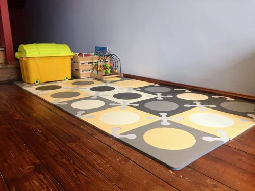 a rug on the floor in a room at Tumitak Sarnia Family & Friends in Karpacz