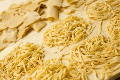 a pile of pasta on a cutting board at Locanda Sant'Agata in San Giuliano Terme