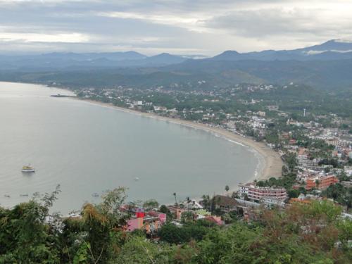 a view of a beach with a town and a city at Paraiso del Pescador in Rincon de Guayabitos