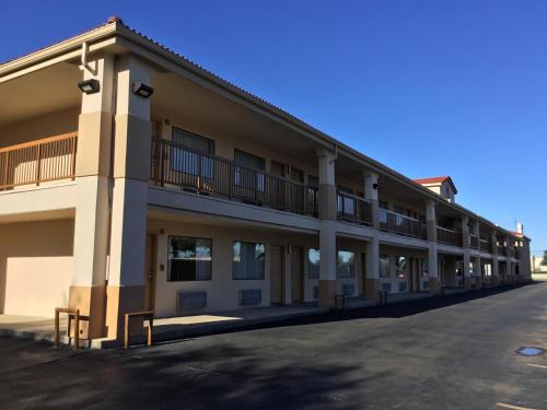 a large building with balconies on the side of it at Days Inn by Wyndham Near Seaworld San Antonio in San Antonio