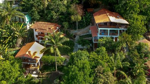 an overhead view of a house in the trees at Pousada Residence Vila das Flores in Morro de São Paulo