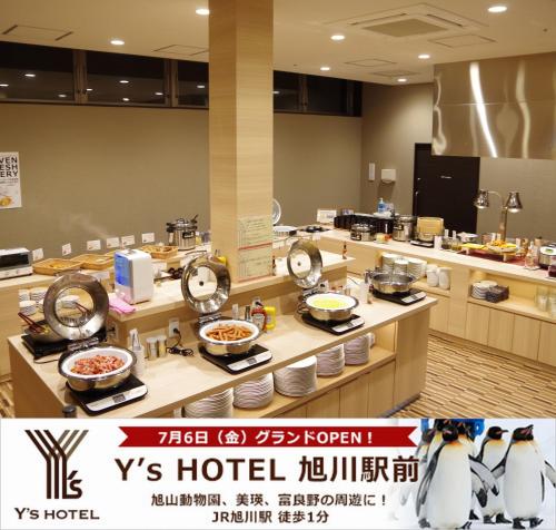 a restaurant with penguins on the counter with food at Y's Hotel Asahikawa Ekimae in Asahikawa