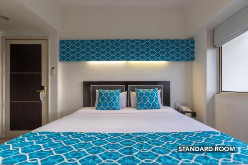 Katil atau katil-katil dalam bilik di Orchid Garden Suites