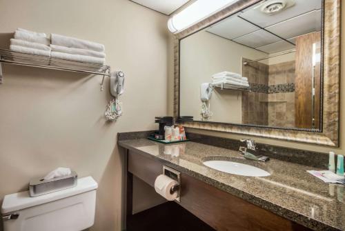 A bathroom at Quality Inn & Suites