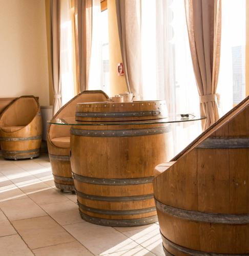 a room with a bunch of wine barrels at Penzión u Vinára in Veľký Krtíš